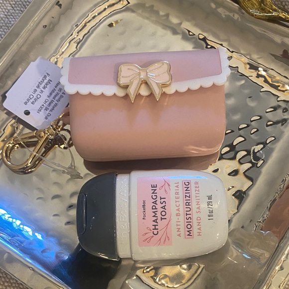 Bath & Body Works Accessories - Bath & Body Works Scalloped Bow pink case & Champagne  Toast hand sanitizer